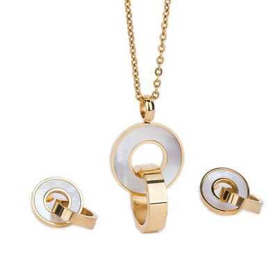 Gold jewelry set with circular design on a white background