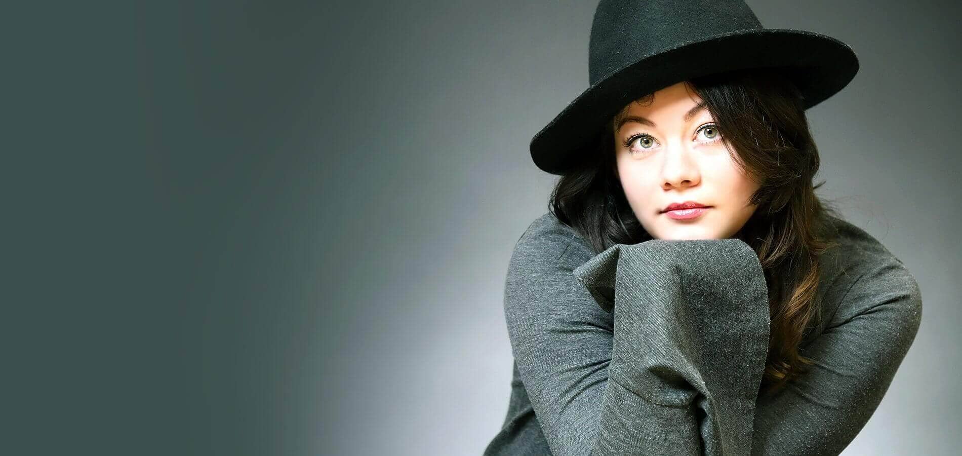 Portrait of a young woman wearing a black hat - New fashion and lifestyle trends at FTF Market UK